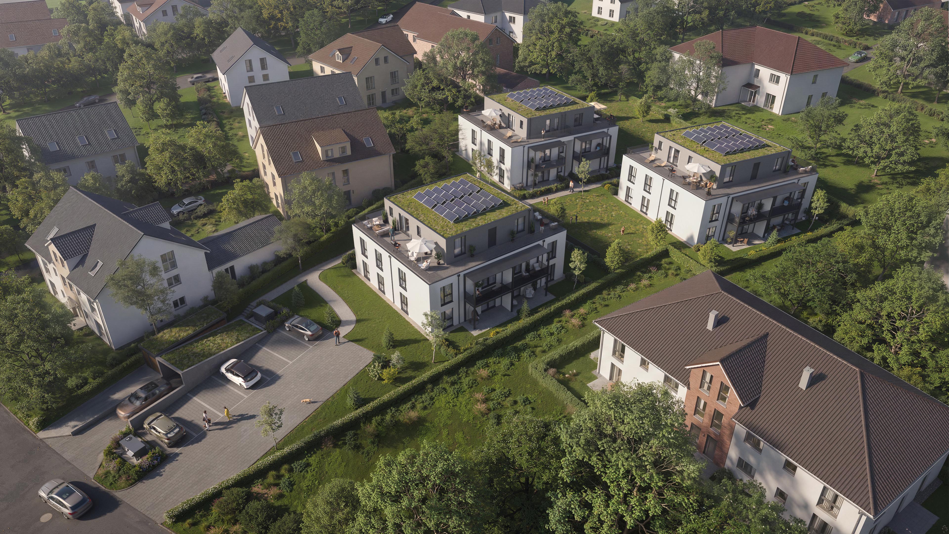 Aerial view of City Suites in Pfarrkirchen with three apartment buildings, planted roofs, and solar panels