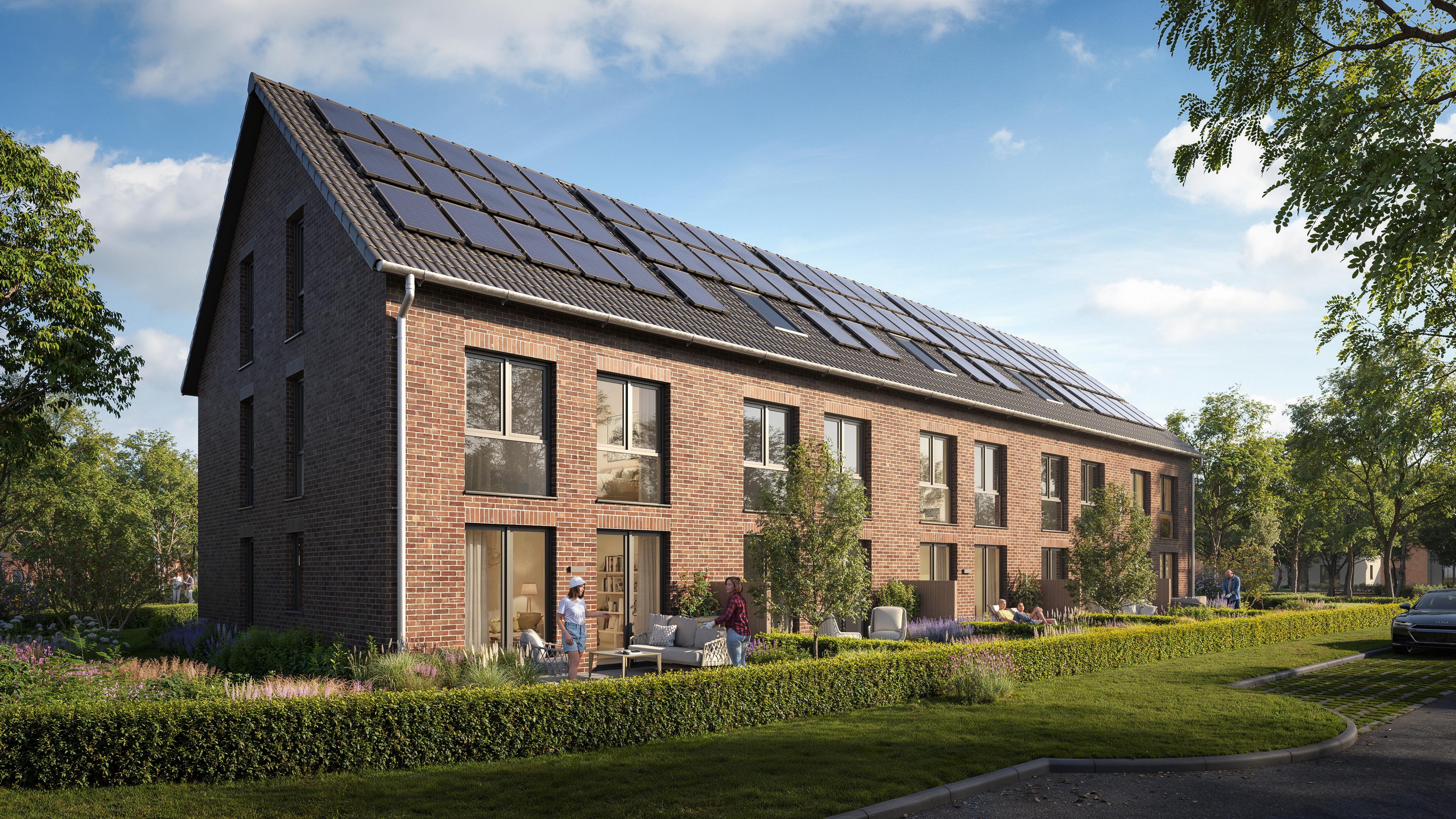 Oblique view of Guldener Hofe showing a brick gable, tall windows, and landscaped terraces