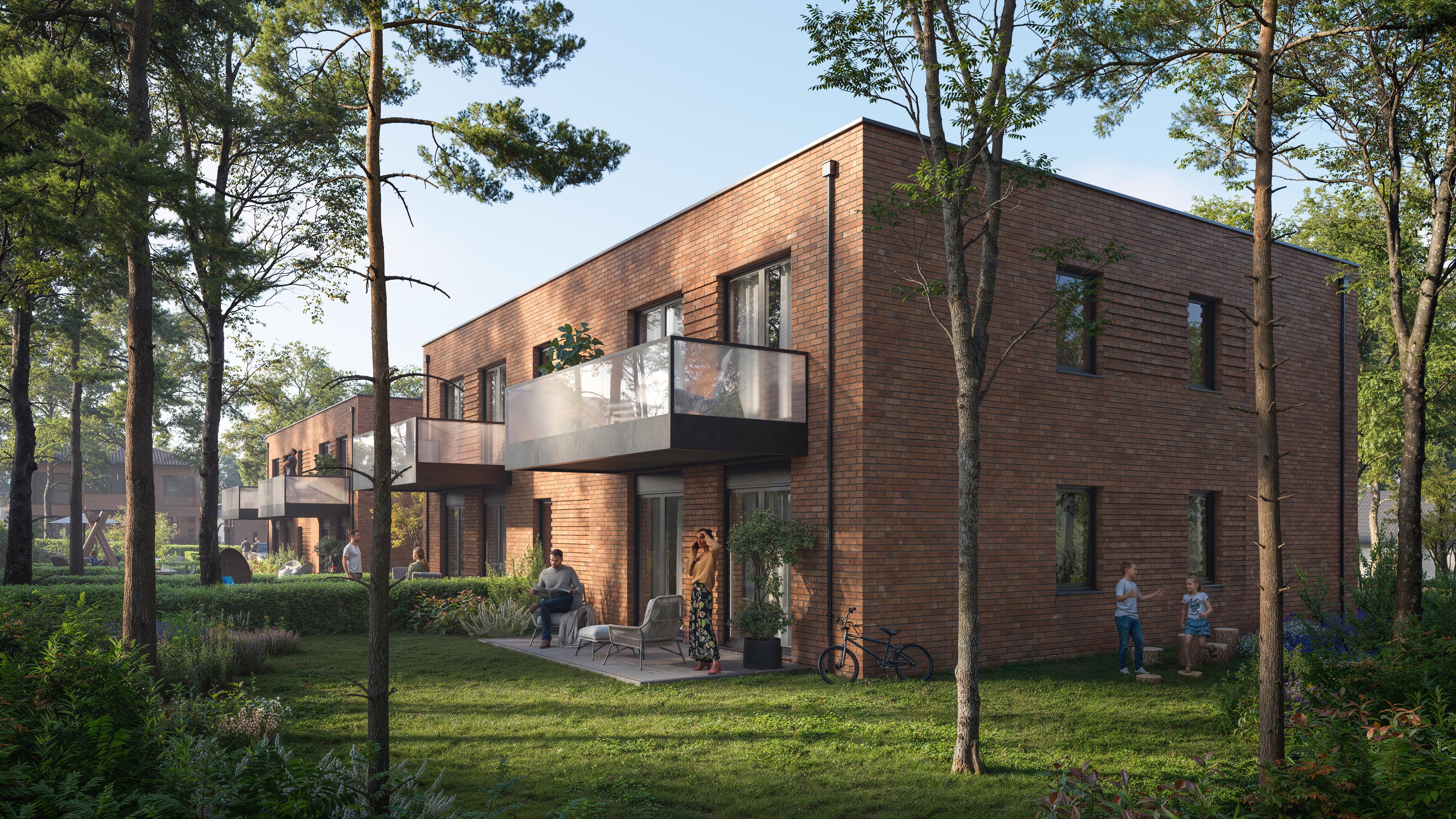 Wohnen am Petersberg garden façade with projecting glass balconies and private terraces among trees